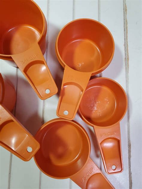 Orange tupperware measuring cups - Vintage Tupperware Measuring Cups *Sold Individually* Pick a Color, Sage Green, Sheer, Orange, Yellow, Cream. (891) $24.95. Replacement Tupperware Measuring Spoons and Rings - Various Colors and Sizes - Lime Green, Yellow, Fireworks, Orange and More! Baking. (745) $3.49.